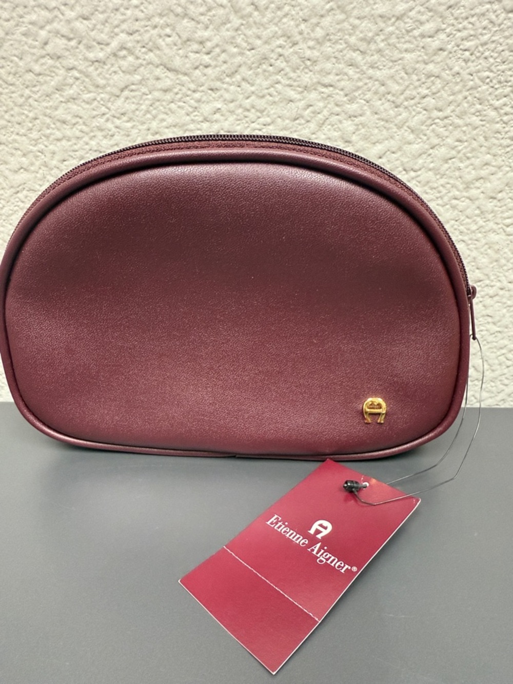 Etienne Aigner Burgundy Vinyl Travel Pouch with Gold Emblem